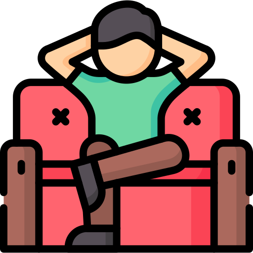 A person relaxing on a sofa with their hands behind their head, representing the comfort of moving into a new home.