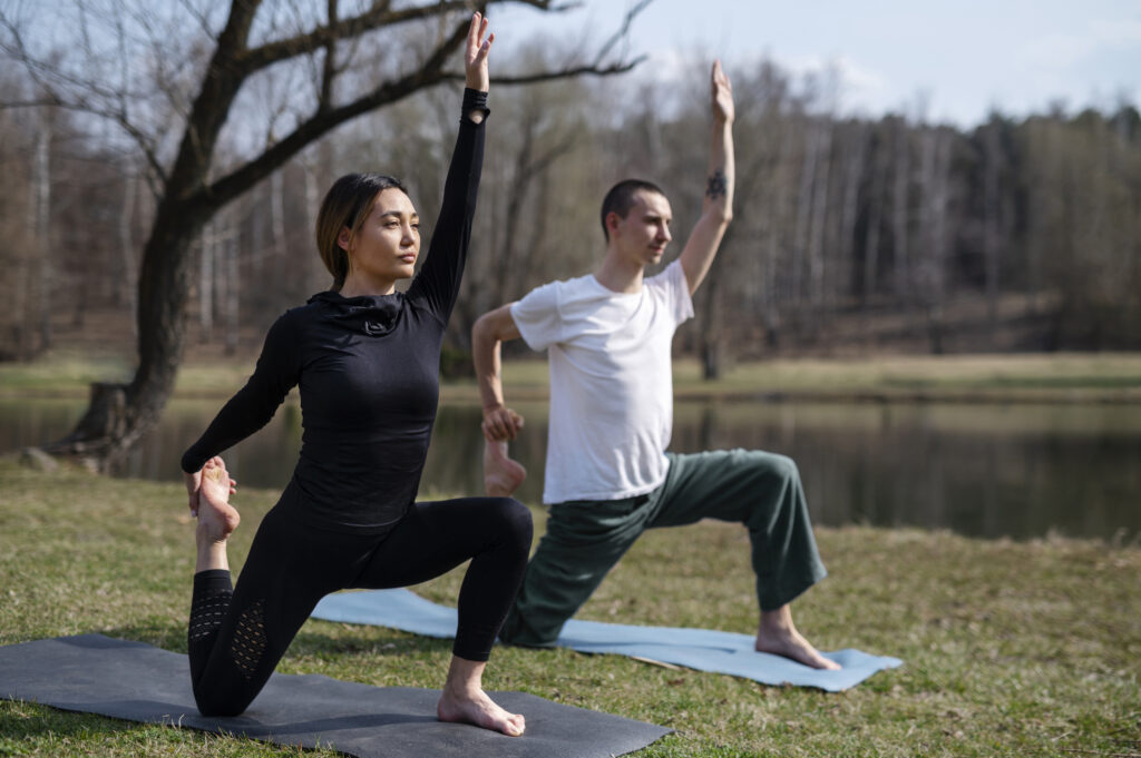 people exercising outdoors at a waterfront field