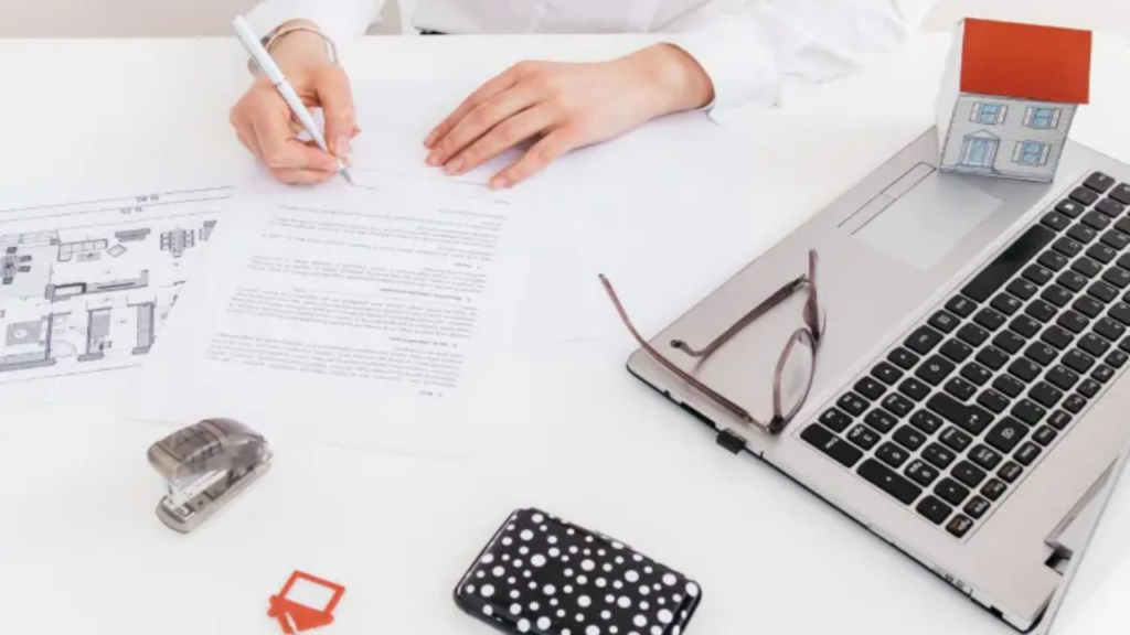 A visual depicting the execution of a legal contract or property agreement, highlighting the formal process of signing official paperwork.